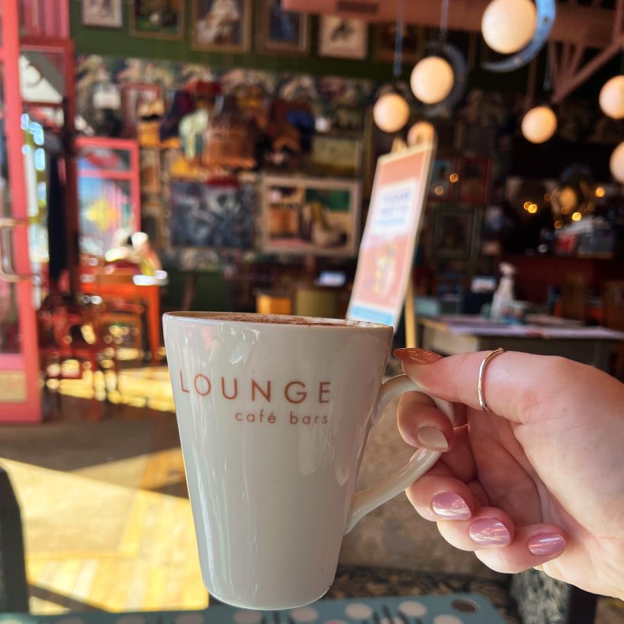 Holding a mug inside Bianco Lounge